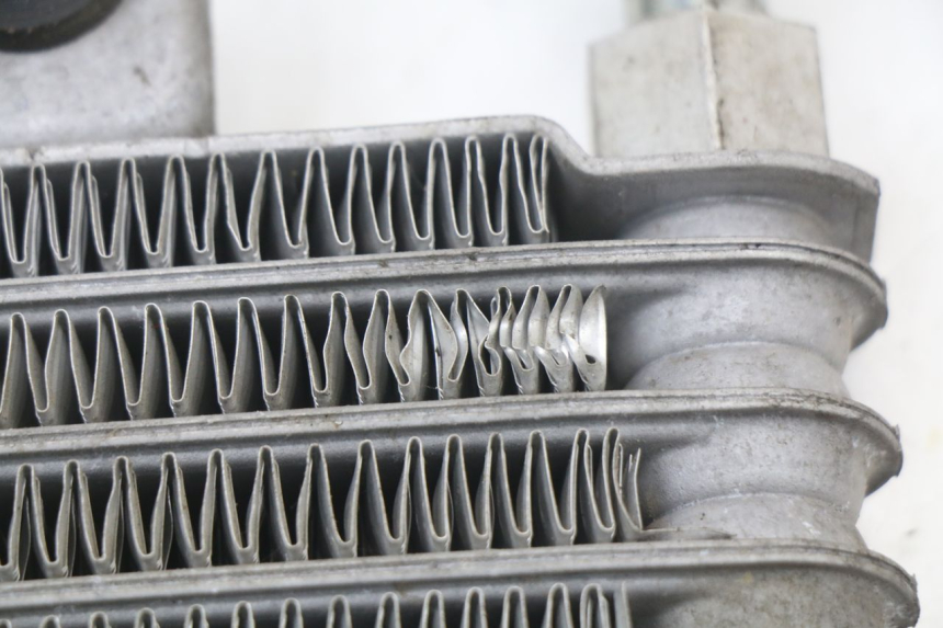 photo de RADIATEUR HUILE HYOSUNG XRX 125 (2000 - 2008)